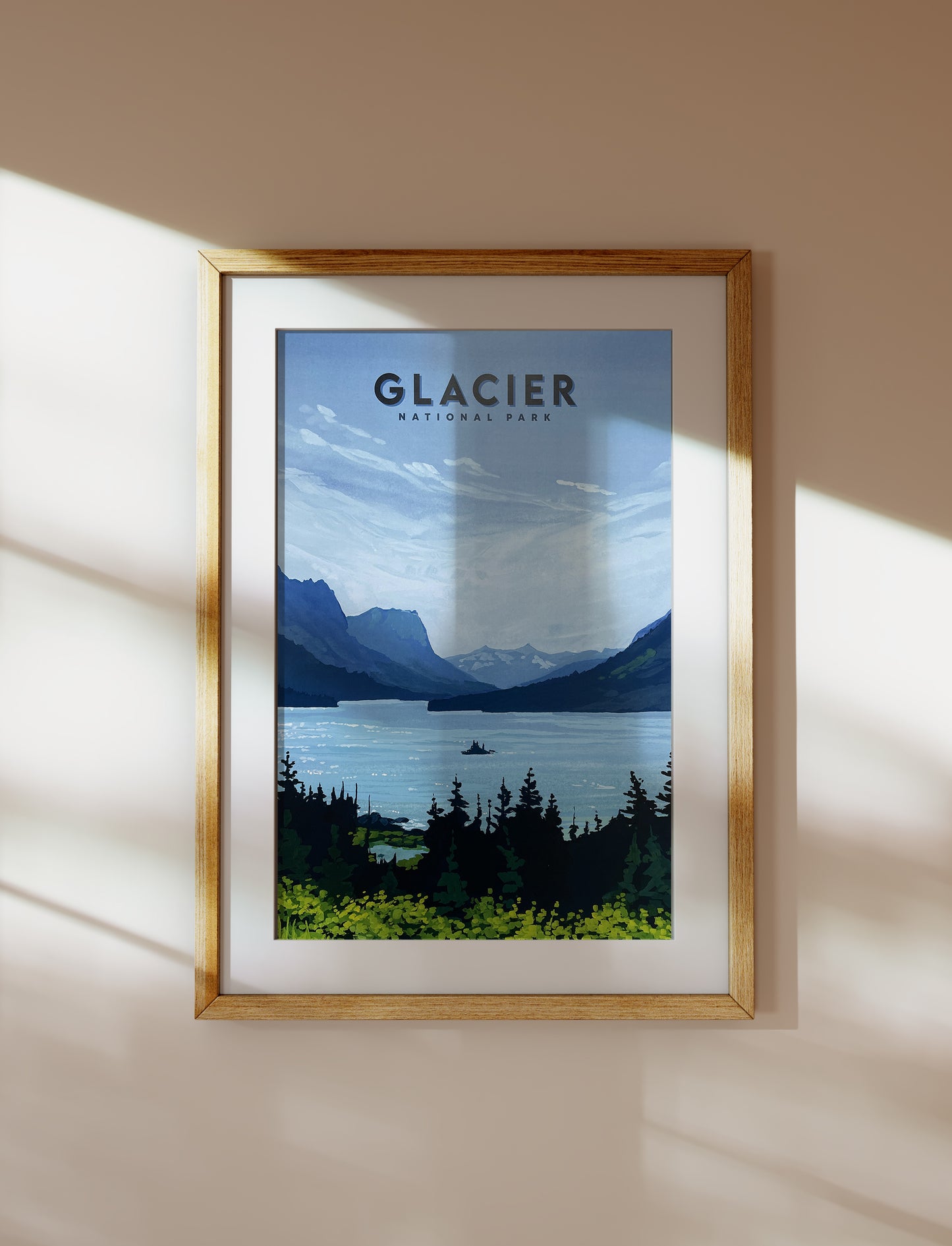 Image of a framed travel poster for Montana’s Glacier National Park. Background image of poster is a painting of Wild Goose Island and St. Mary Lake.