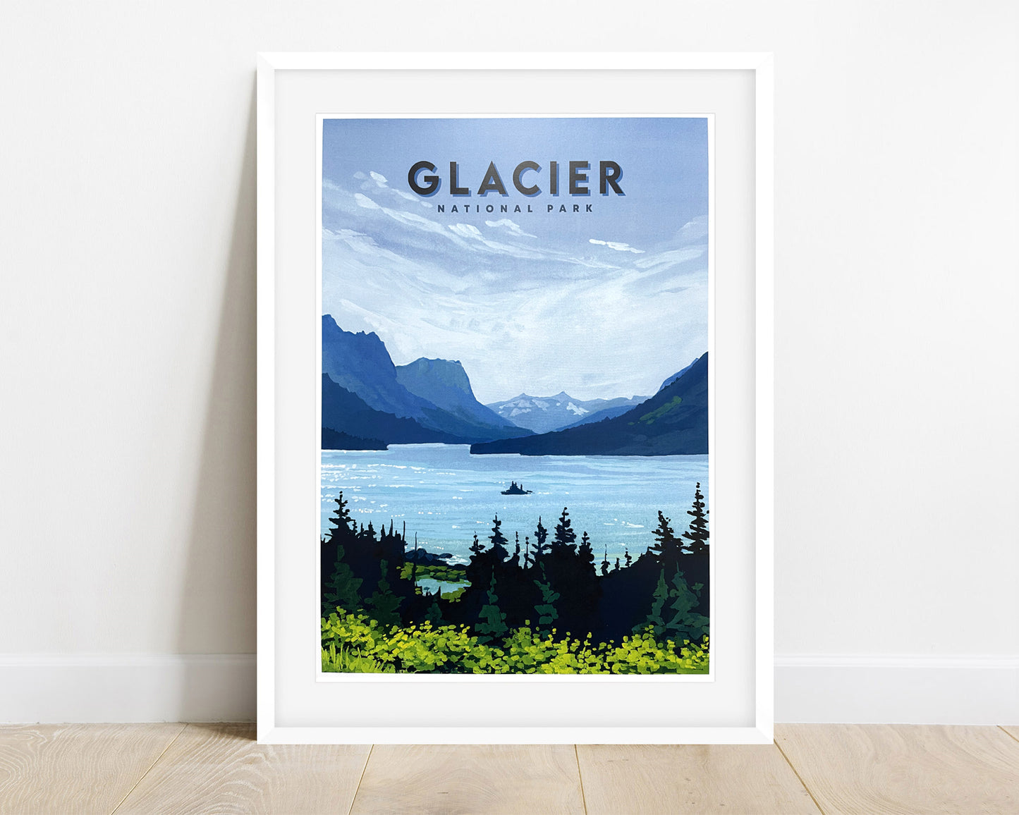 Image of a framed travel poster for Montana’s Glacier National Park. Background image of poster is a painting of Wild Goose Island and St. Mary Lake.