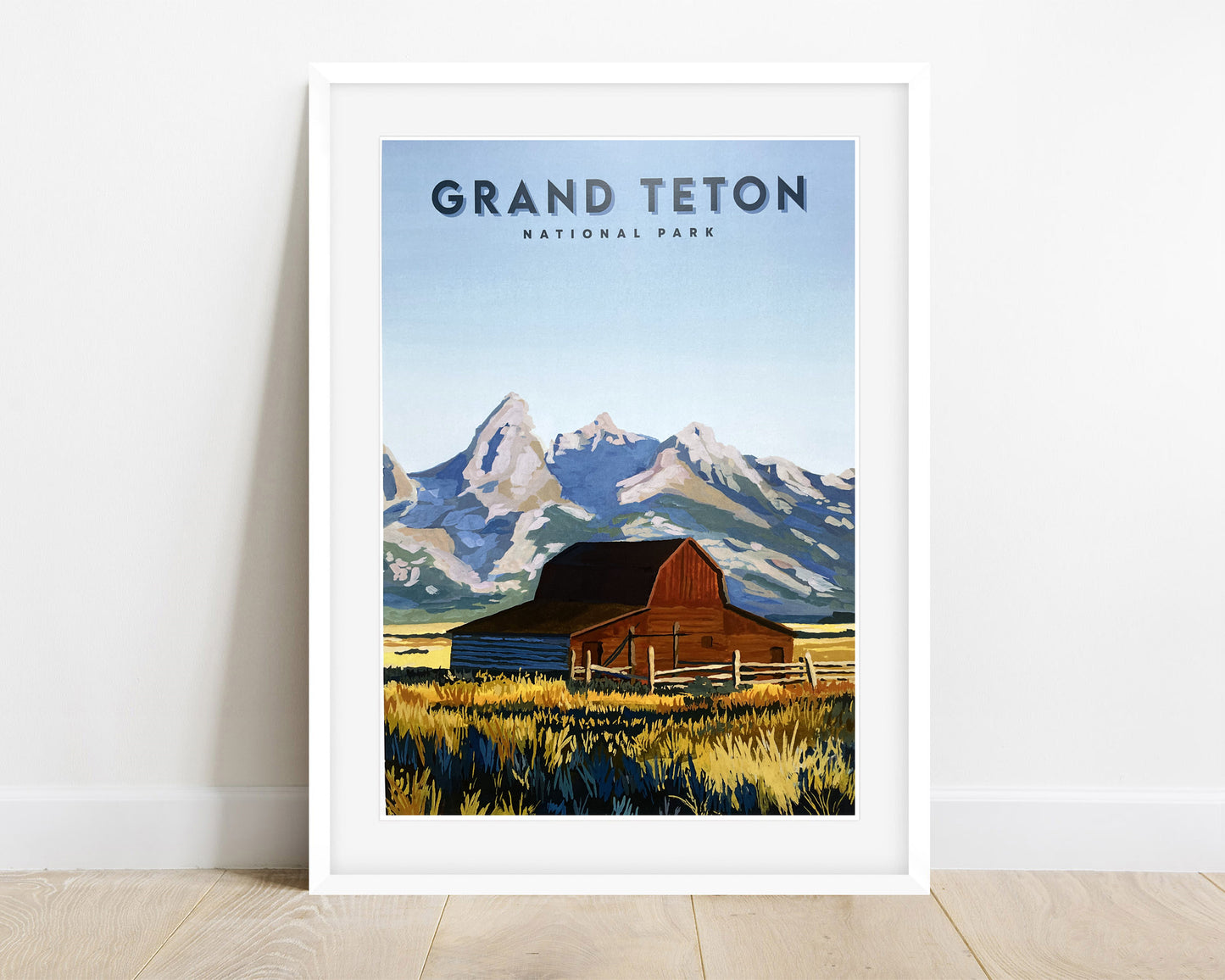 Framed Travel Poster of Grand Teton National Park. Background image of travel poster features landscape painting of T.A. Moulton Barn